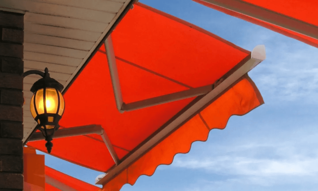 A red awning outside a commercial facility